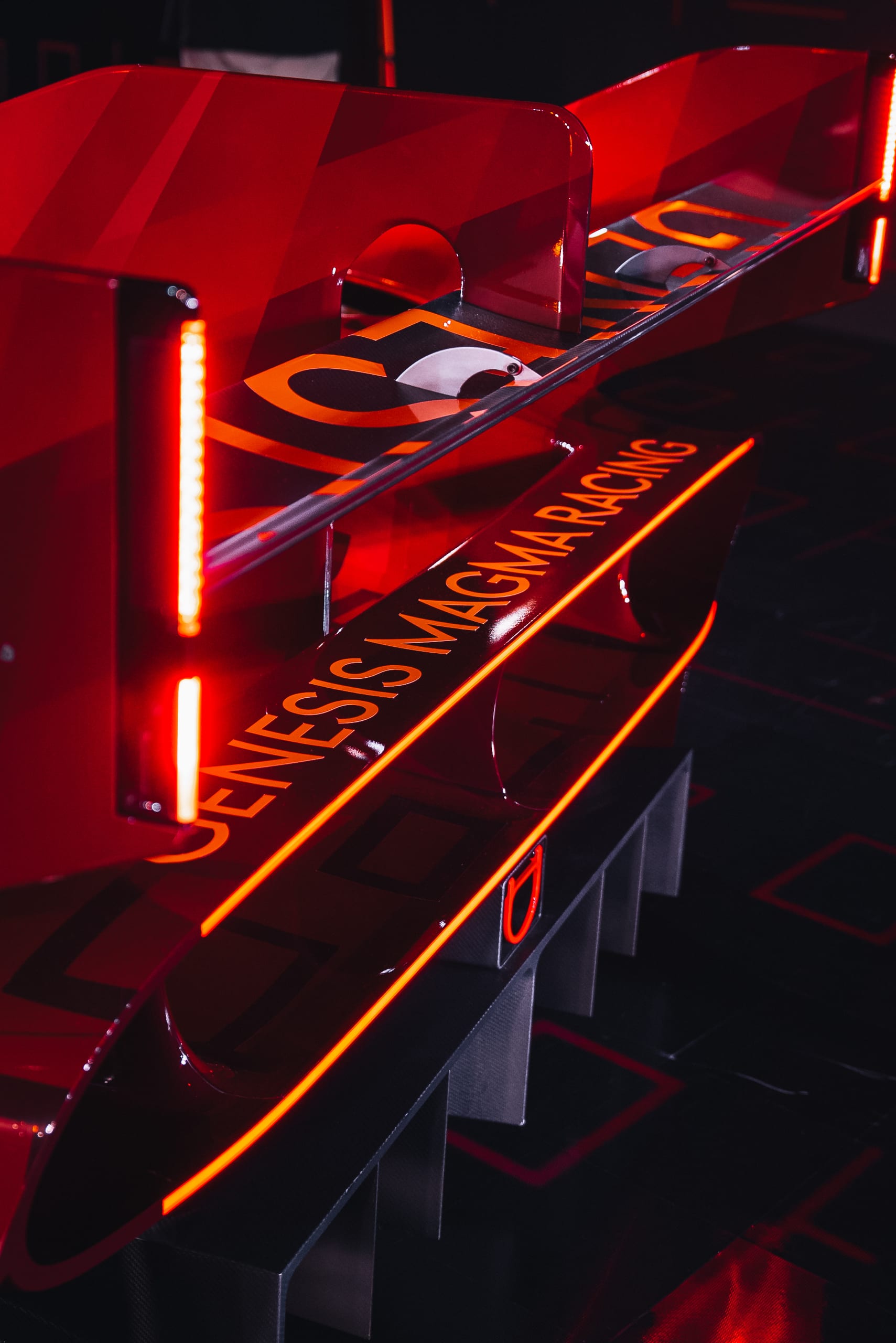 Detail of the Genesis Magma Racing rear wing with illuminated branding